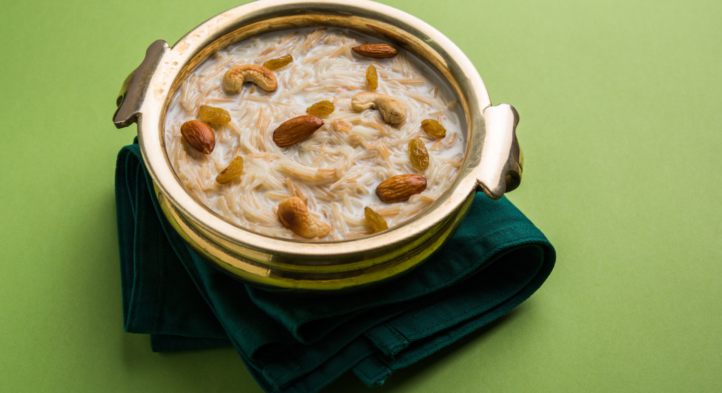 A traditional bowl filled with creamy Semiya Mix garnished with almonds, cashews, and raisins, placed on a green napkin.