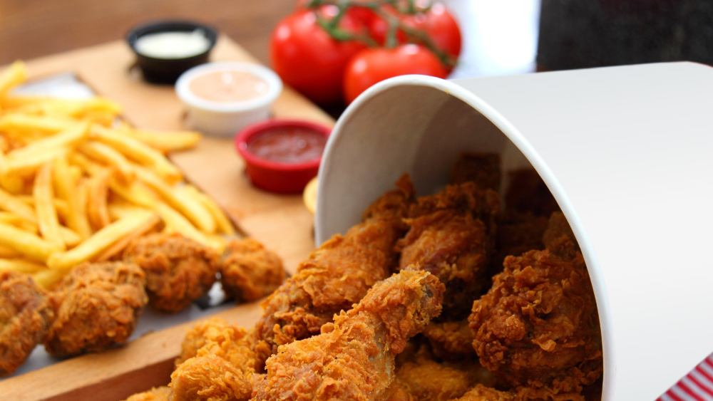 Crispy fried chicken served with French fries and dipping sauces
